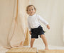 Short Agus Azul Navy para niño usado sin cargaderas con diseño clásico y elegante.
