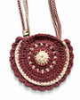Textura del crochet hecho a mano y acabados del Bolso Boho Pink para niña.