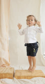 Short Agus Azul Navy para niño en lino con cargaderas ajustables de La Tutu.