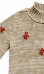 Detalle de textura saco Tejido Flores Forest arena para niña en algodón con flores bordadas a mano en naranja de La Tutu.