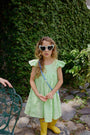 Vestido Lara Verde Limon para niña confeccionado en lino 100% natural con boleros en los hombros.