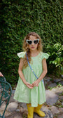Vestido Lara Verde Limon para niña confeccionado en lino 100% natural con boleros en los hombros.