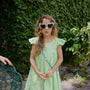 Vestido Lara Verde Limon para niña confeccionado en lino 100% natural con boleros en los hombros.
